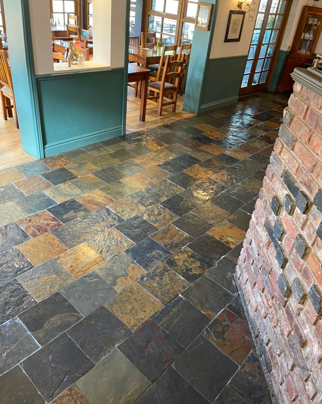 Natural limestone flagstone floor gleaming after professional stone cleaning